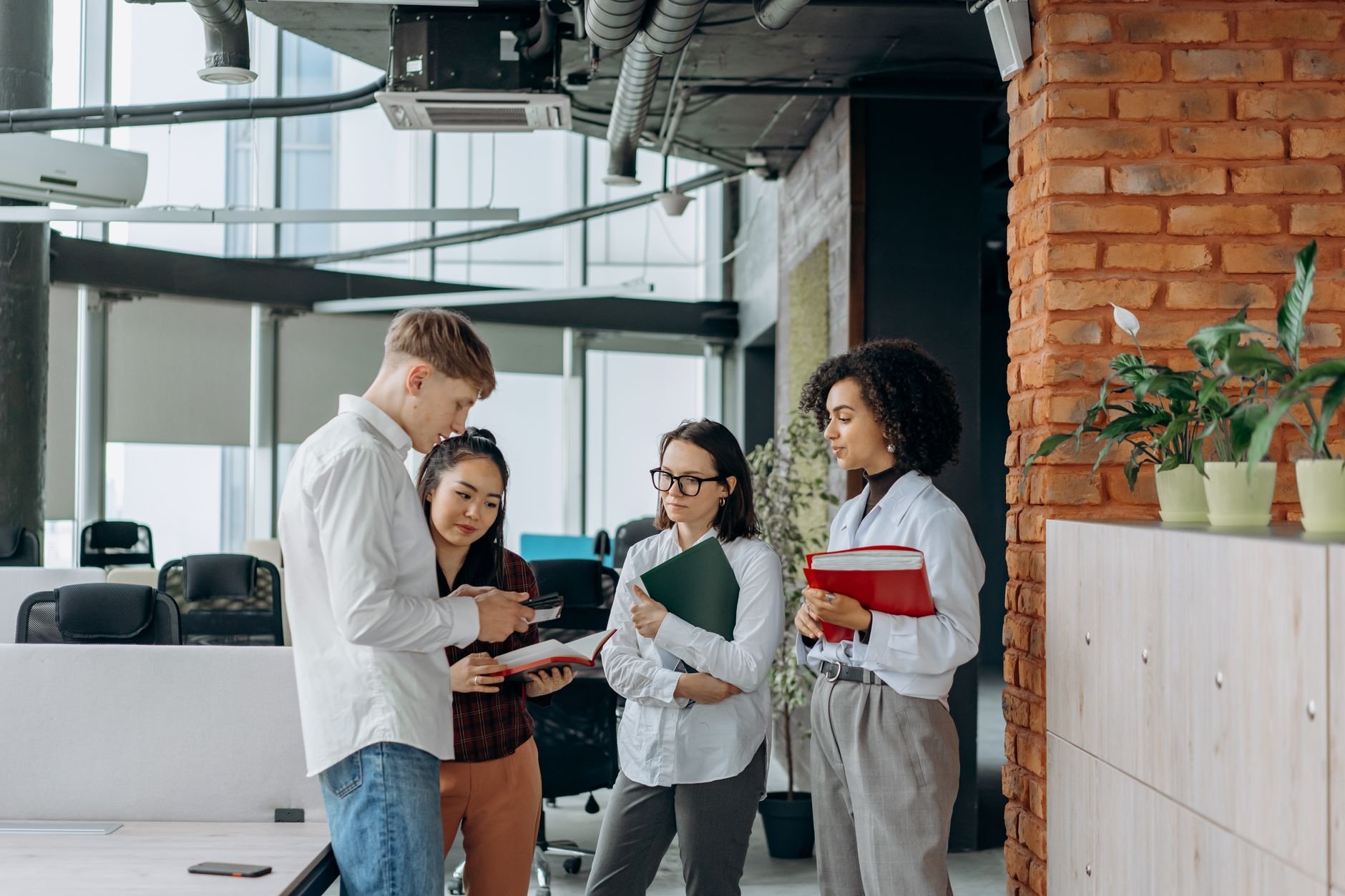 A diverse team of professionals collaborating in a modern office setting
